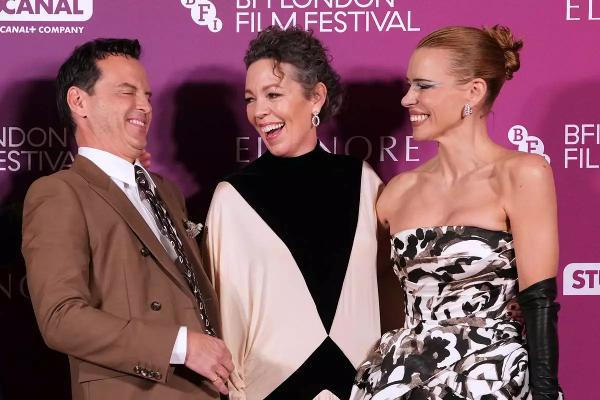 Andrew Scott, from left, Olivia Colman, and Billie Piper pose for photographers upon arrival at the premiere for the film "Elsinore" as part of the London film festival in London, Wednesday, Oct. 7, 2026. (Photo by Scott A Garfitt/Invision/AP)