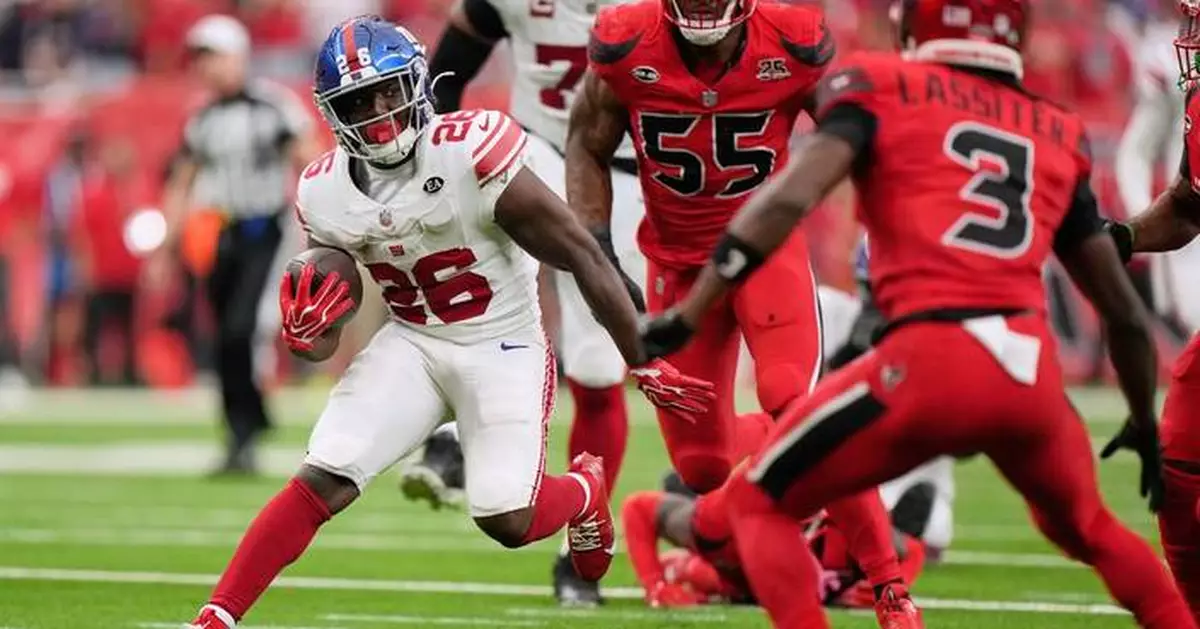 Singletary's 30-yard run in OT gives Giants 27-21 win over Texans