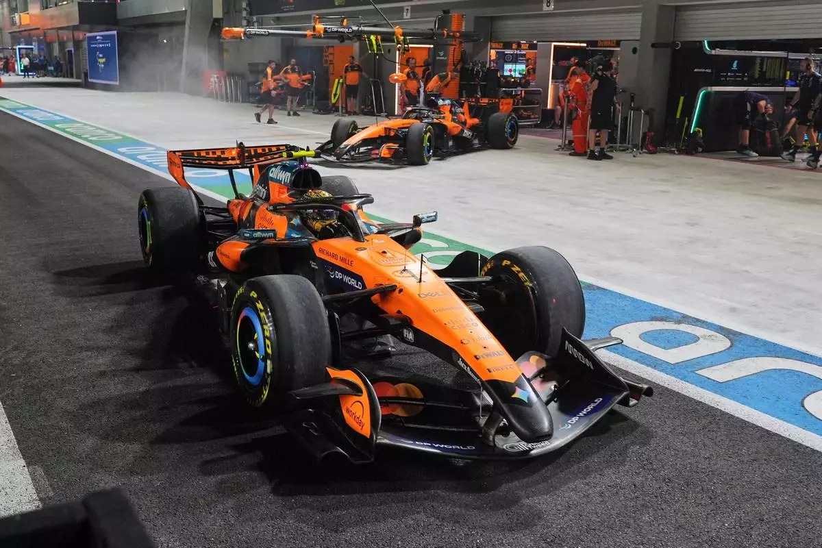 McLaren driver Lando Norris of Britain speeds away during the sprint qualifying session ahead of the Singapore Formula One Grand Prix in Singapore, Friday, Oct. 9, 2026. (AP Photo/Ng Han Guan, Pool)