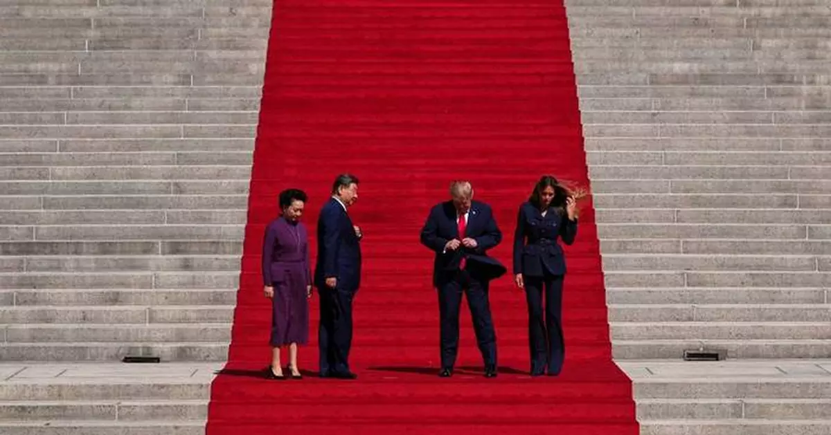 11 minutes on the steps: How an AP photographer framed Trump and Xi’s red-carpet shot