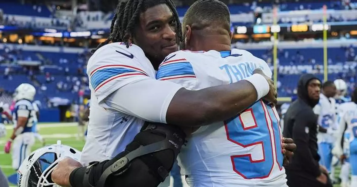 Titans use special teams plays and defense to rally past Colts 26-20 for 1st win of the season