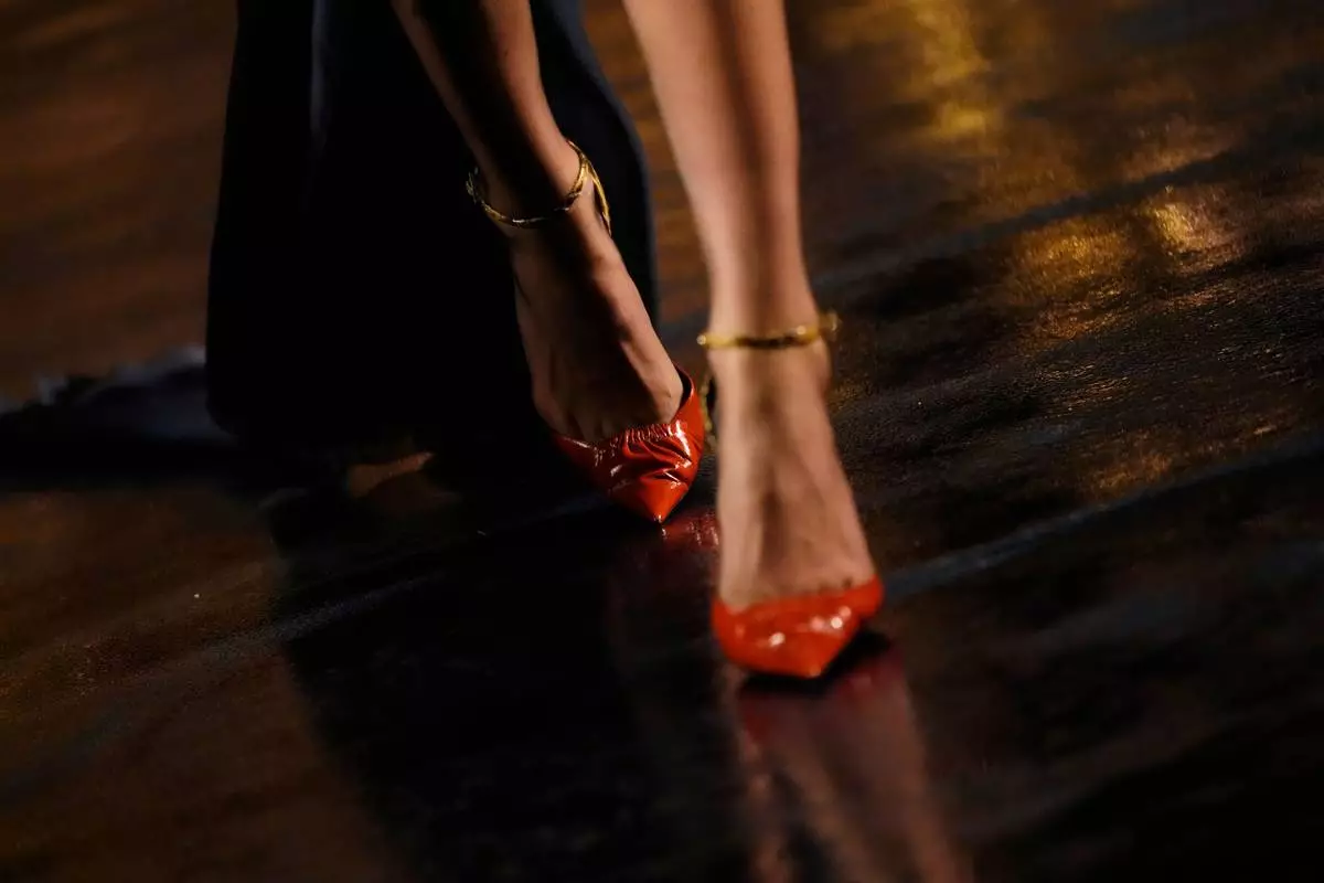 A model wears a creation as part of the Saint Laurent Womenswear Spring Summer 2027 collection presented in Paris, France, Tuesday, Sept. 29, 2026. (AP Photo/Teresa Suarez)