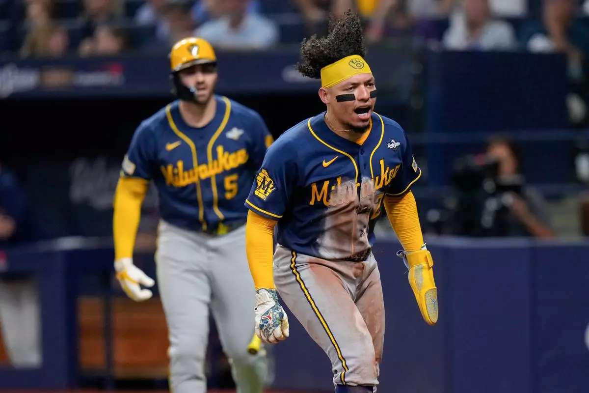 Milwaukee Brewers catcher William Contreras celebrates scoring on a sacrifice fly by Cooper Platt during the sixth inning of Game 5 of baseball's World Series, Wednesday, Oct. 28, 2026, in St. Petersburg, Fla., between the Milwaukee Brewers and the Tampa Bay Rays. (AP Photo/Chris O'Meara)