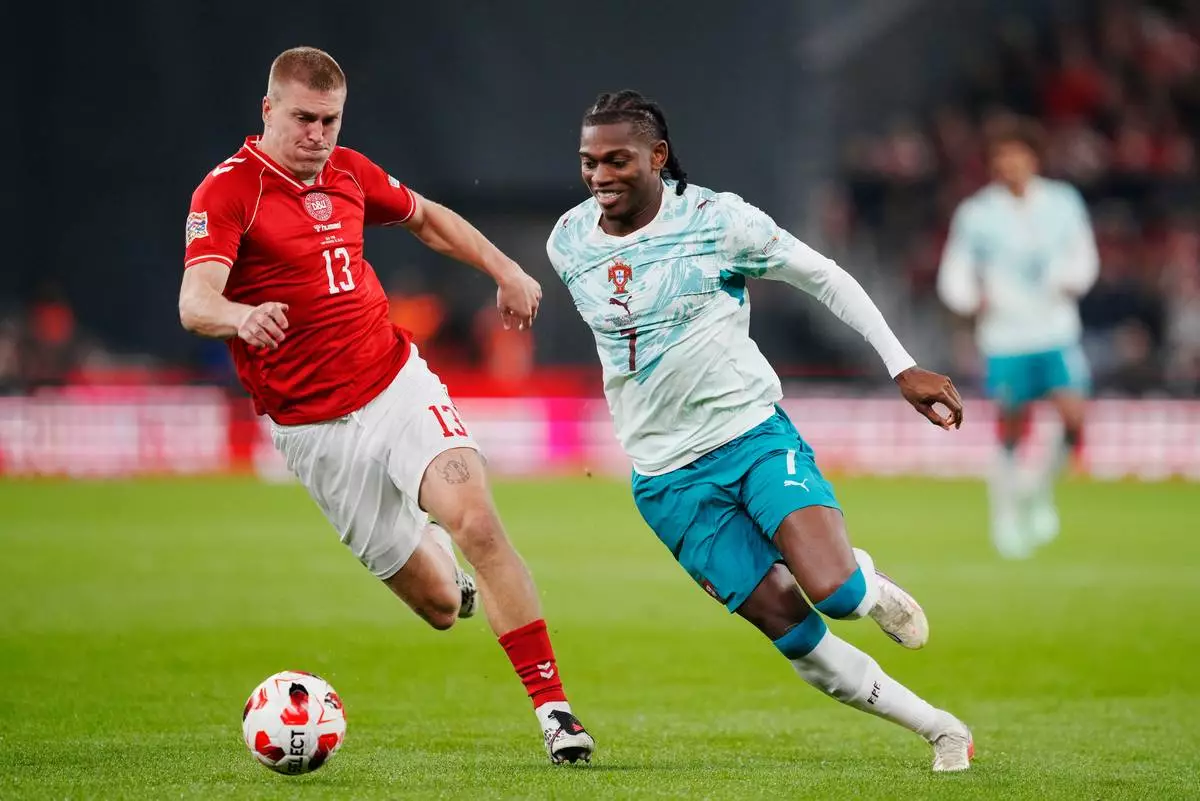 Denmark's Rasmus Nissen Kristensen, left, and Portugal's Rafael Leao in action during the Nations League soccer match between Denmark and Portugal, in Copenhagen, Thursday, Oct. 1, 2026. (Sebastian Elias Uth/Ritzau Scanpix via AP)