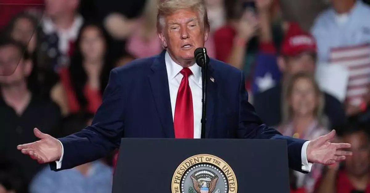 The Latest: Trump interrupted by protesters as he campaigns for Paxton in US Senate race in Texas