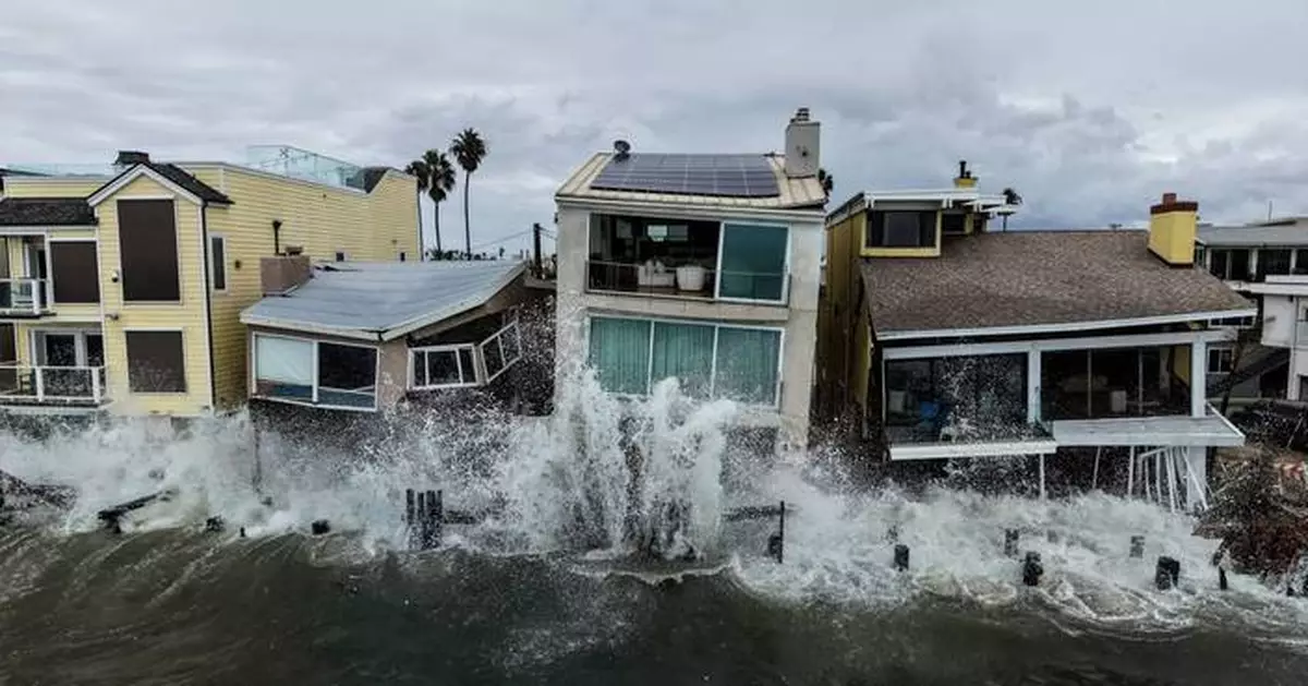 Using a drone, AP's Jae C. Hong frames Long Beach's waves crashing into oceanfront homes