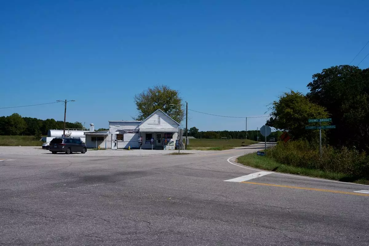 A rural crossroads in Franklin County with a couple of political signs is seen, Oct. 8, 2026, in Louisburg, N.C. (AP Photo/Matt Ramey)