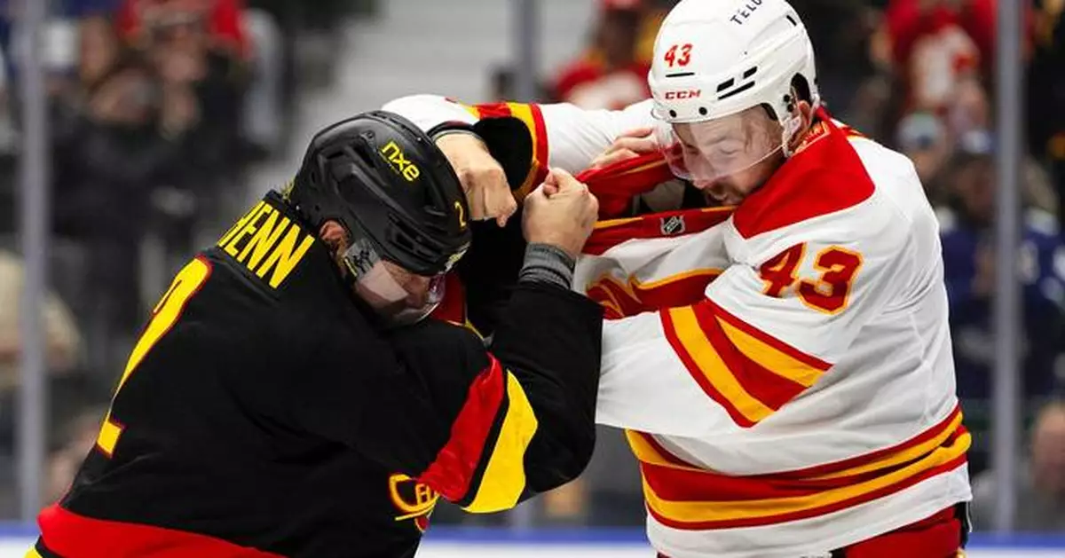 Merilainen makes 23 saves in first start for the Canucks in a 4-1 victory over the Flames