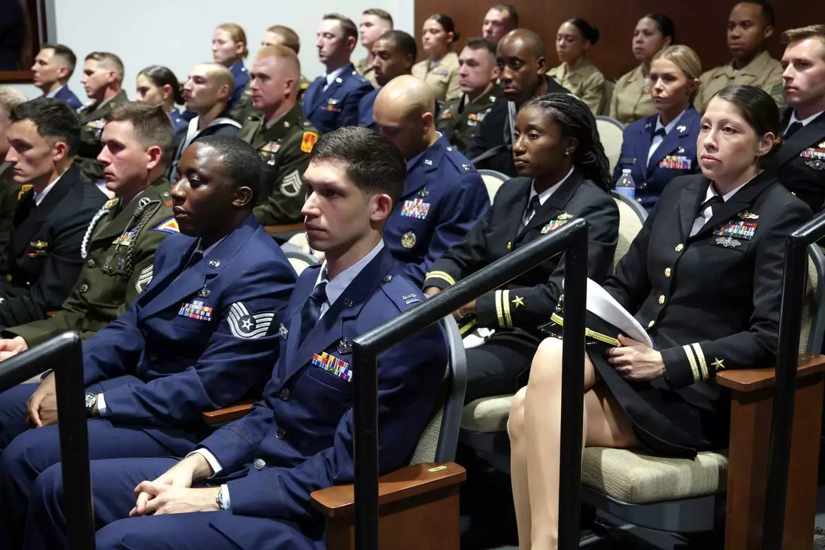 Members of the military listen as Secretary of Defense Pete Hegseth gives a State of the Force address at Marine Corps Base Quantico, Wednesday, Sept. 30, 2026 in Quantico, Va. (Alex Wong/Pool Photo via AP)
