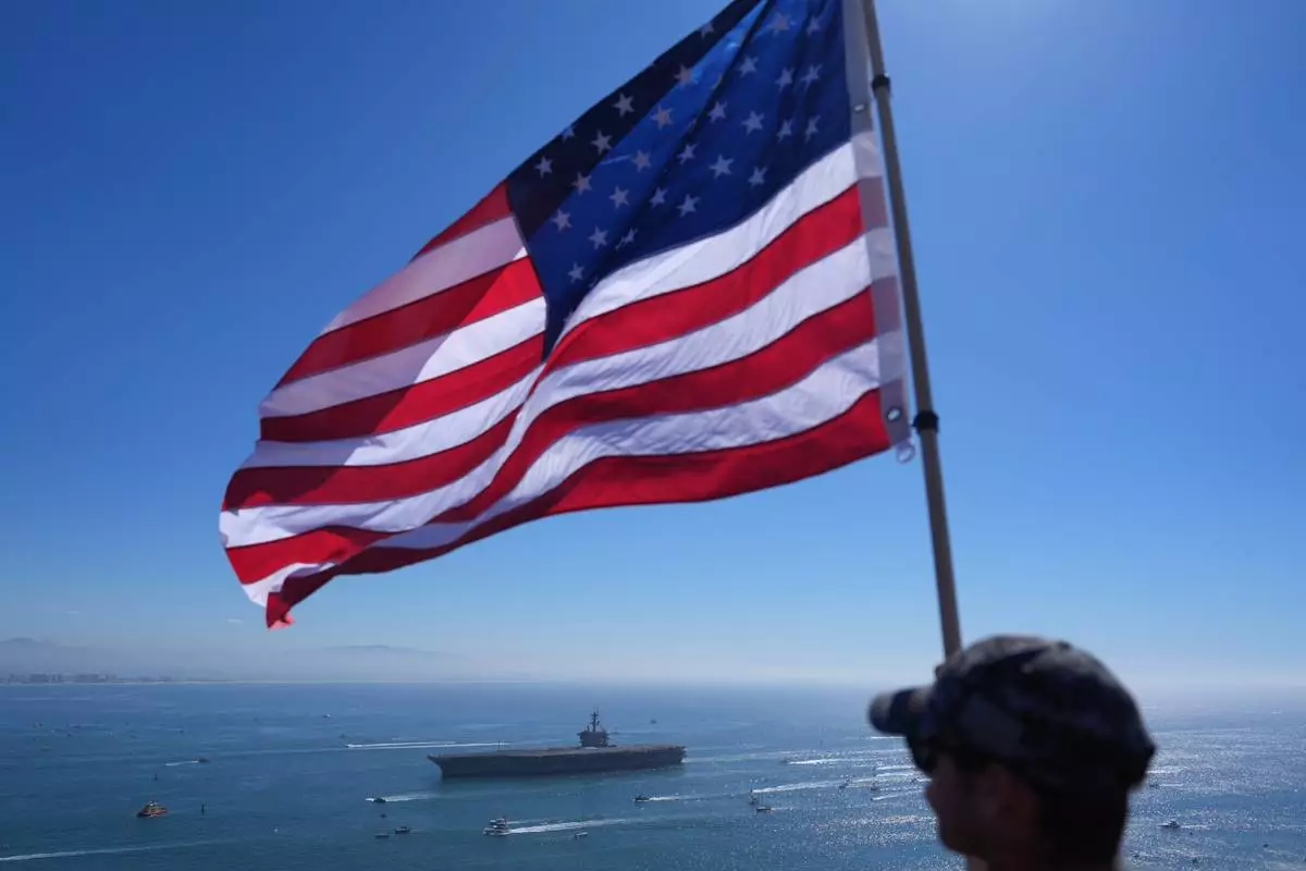 The USS Abraham Lincoln aircraft carrier returns to the San Diego Bay after deployment Thursday, Oct. 8, 2026, in San Diego. (AP Photo/Jae C. Hong)