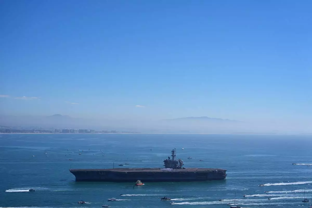 The USS Abraham Lincoln aircraft carrier returns to the San Diego Bay after deployment Thursday, Oct. 8, 2026, in San Diego. (AP Photo/Jae C. Hong)