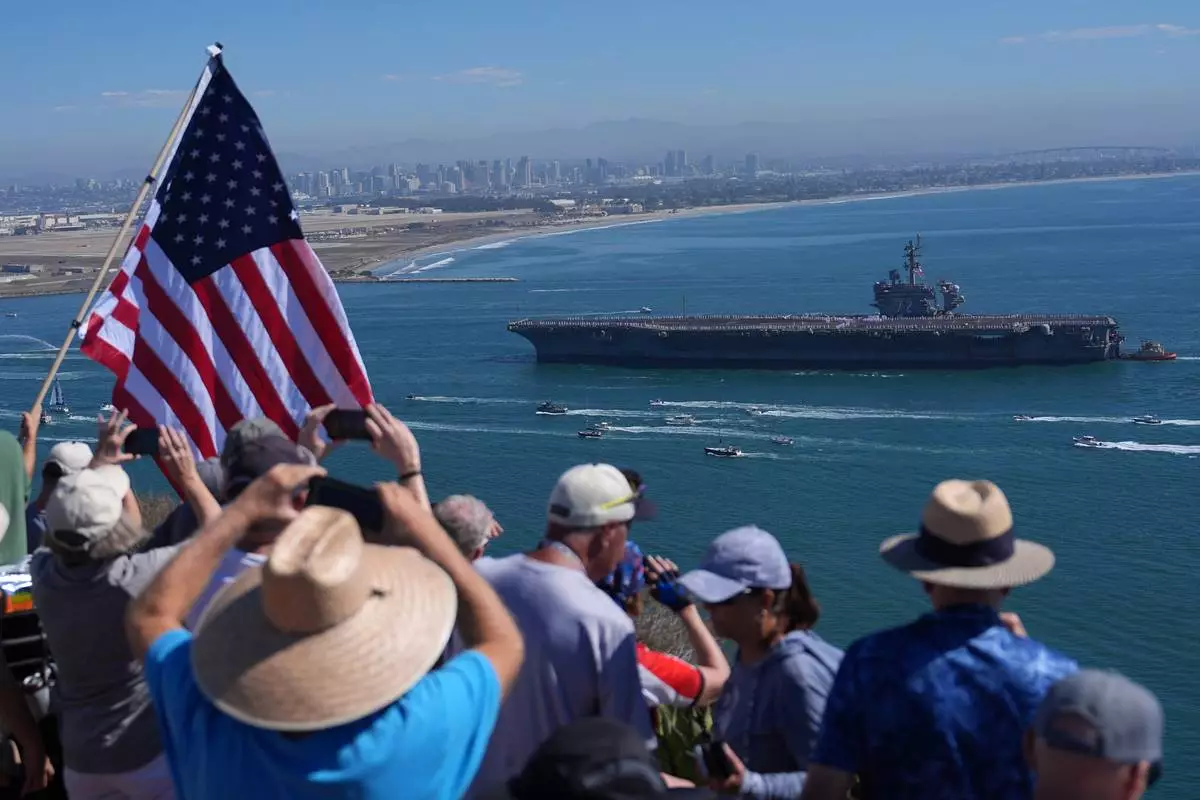 The USS Abraham Lincoln aircraft carrier returns to the San Diego Bay after deployment Thursday, Oct. 8, 2026, in San Diego. (AP Photo/Jae C. Hong)