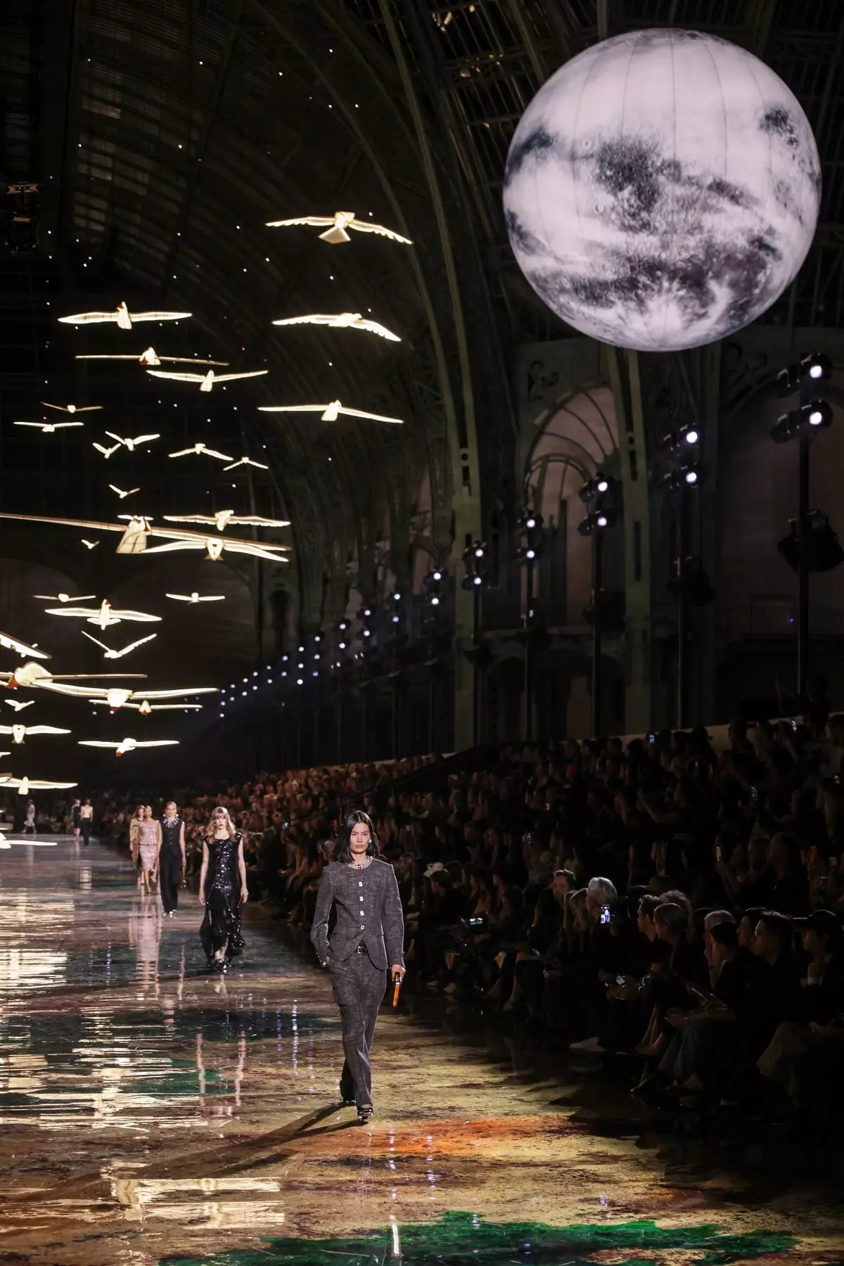 Models wear creations as part of the Chanel Womenswear Spring Summer 2027 collection presented in Paris, France, Monday, Oct. 5, 2026. (AP Photo/Thomas Padilla)