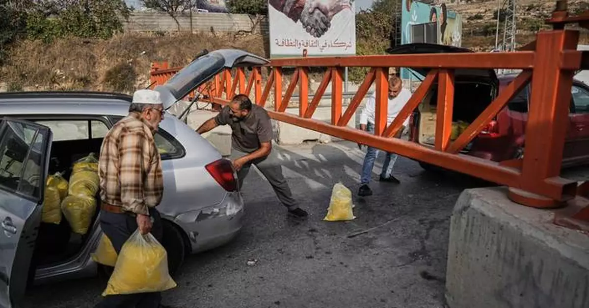 Israel imposes closures across a West Bank city after attacks, and other Mideast news