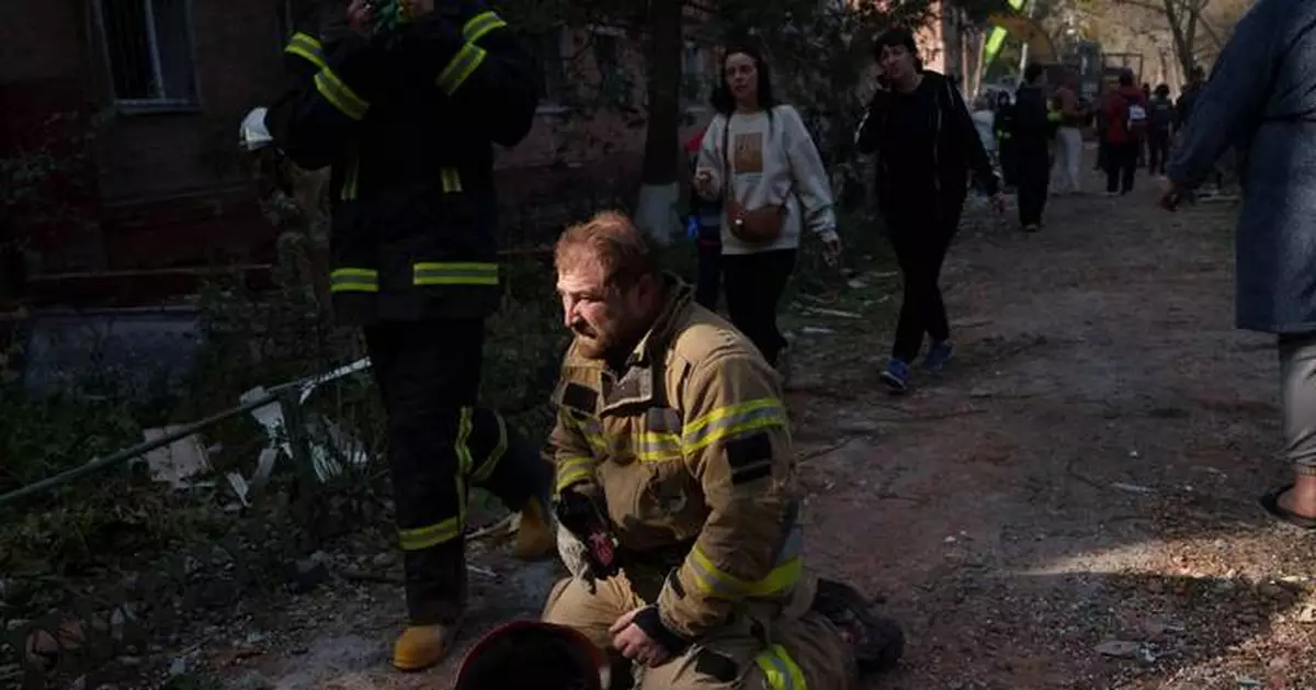 Rescuers pull bodies from rubble as Ukraine's death toll rises to 22 from a Russian missile strike
