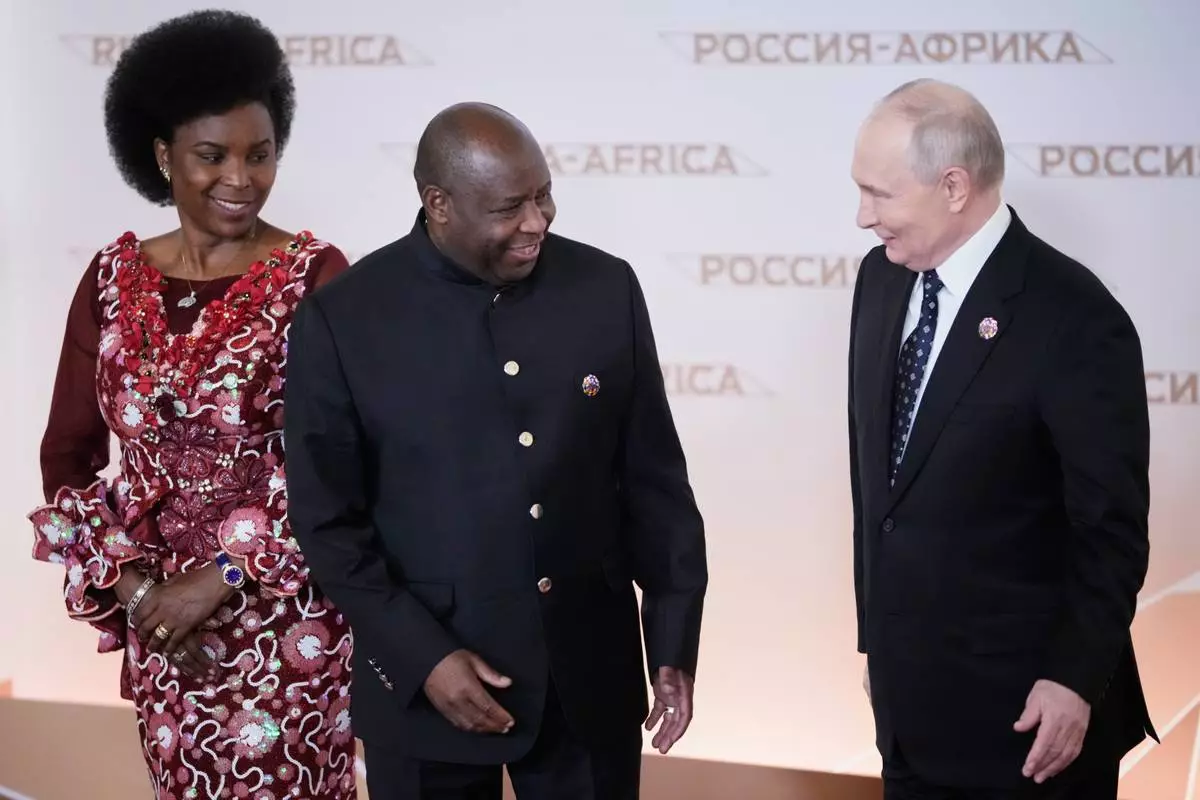 Russian President Vladimir Putin, right, greets Burundi's President Evariste Ndayishimiye and his wife Angeline at the Russia-Africa Summit in Moscow, Wednesday, Oct. 28, 2026