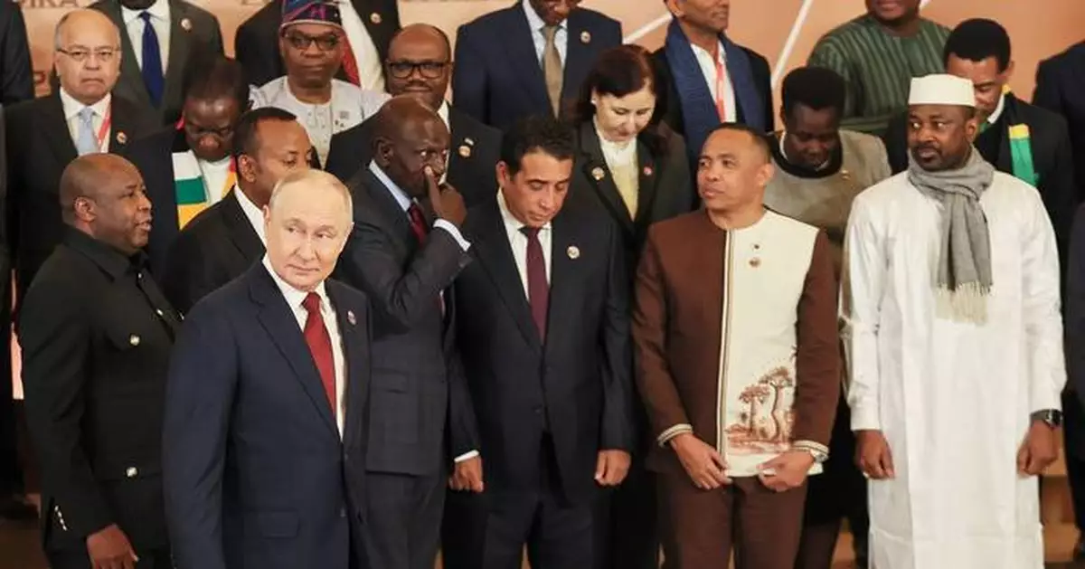 Russian President Vladimir Putin, right, greets Burundi's President Evariste Ndayishimiye and his wife Angeline at the Russia-Africa Summit in Moscow, Wednesday, Oct. 28, 2026