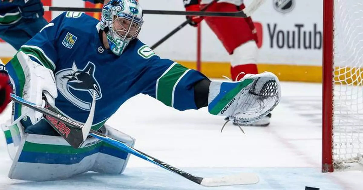Defending champion Hurricanes beat Canucks 6-3 to take NHL lead
