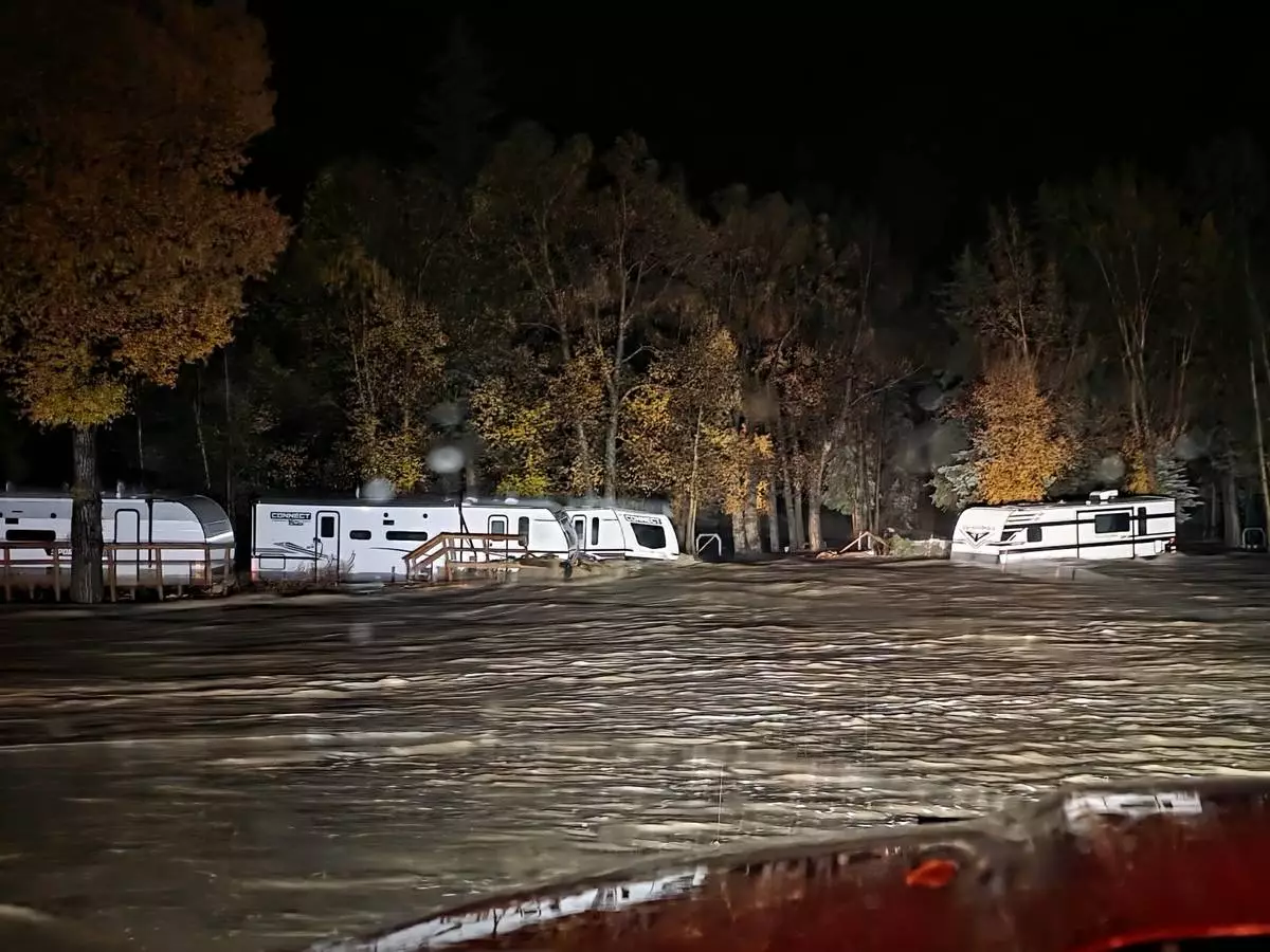 Floodwaters surround trailers at the Fun Valley Family Resort campground and RV part in South Fork, Colo., early Friday, Oct. 23, 2026. (South Fork Fire Rescue via AP)