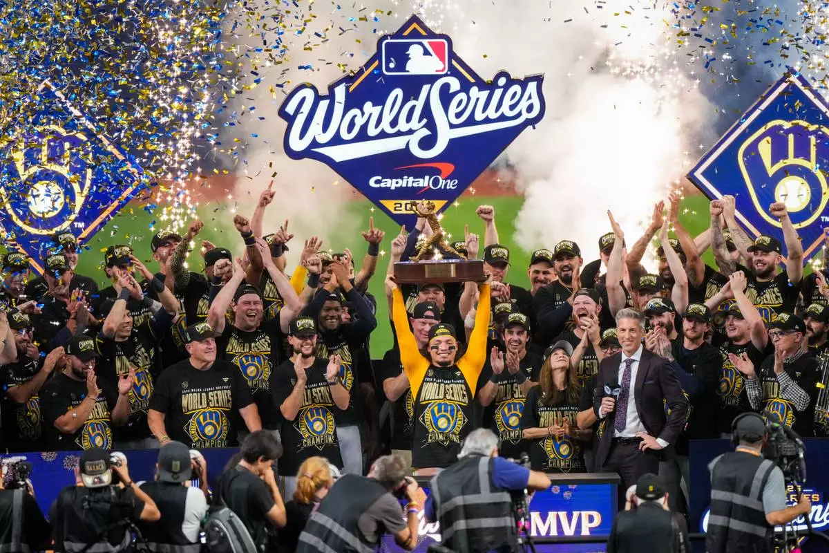 Milwaukee Brewers catcher William Contreras holds the MVP trophy after winning baseball's World Series against the Tampa Bay Rays, Wednesday, Oct. 28, 2026, in St. Petersburg, Fla. (AP Photo/Morry Gash)