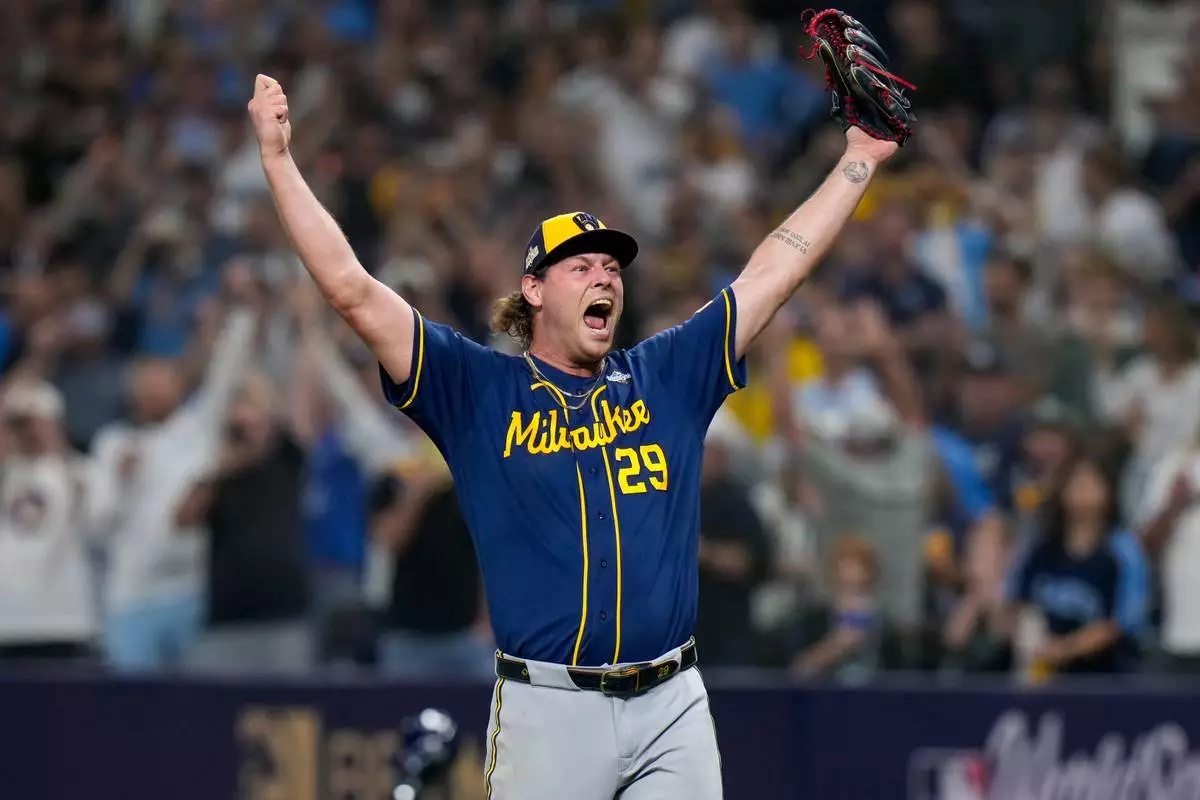 Milwaukee Brewers pitcher Trevor Megill celebrates after winning baseball's World Series, against the Tampa Bay Rays, Wednesday, Oct. 28, 2026, in St. Petersburg, Fla.(AP Photo/Chris O'Meara)