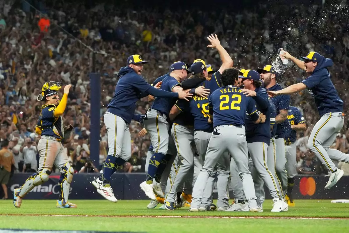 The Milwaukee Brewers celebrate after winning baseball's World Series against the Tampa Bay Rays, Wednesday, Oct. 28, 2026, in St. Petersburg, Fla. (AP Photo/Ashley Landis)