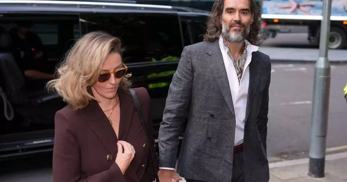 Russell Brand arrives at a London court for his trial on rape and sexual assault charges