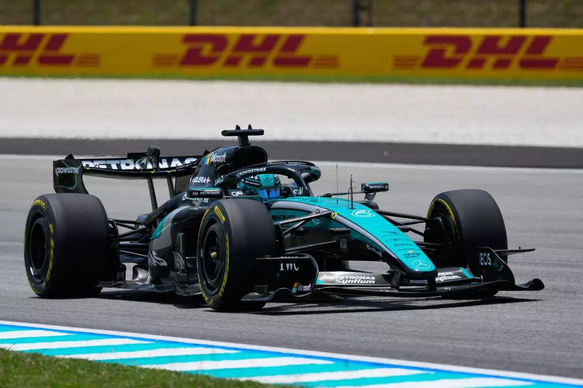 Mercedes driver George Russell of Britain steers his car during the first free practice session ahead of the Bahrain Grand Prix in Sepang, Malaysia, Friday, Oct. 2, 2026. (AP Photo/Vincent Thian)