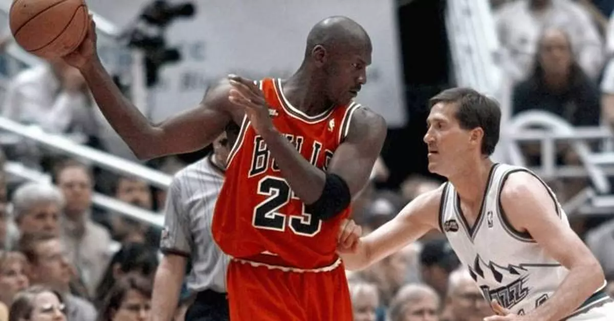 Michael Jordan jersey sets $14 million record for basketball memorabilia, auction house says