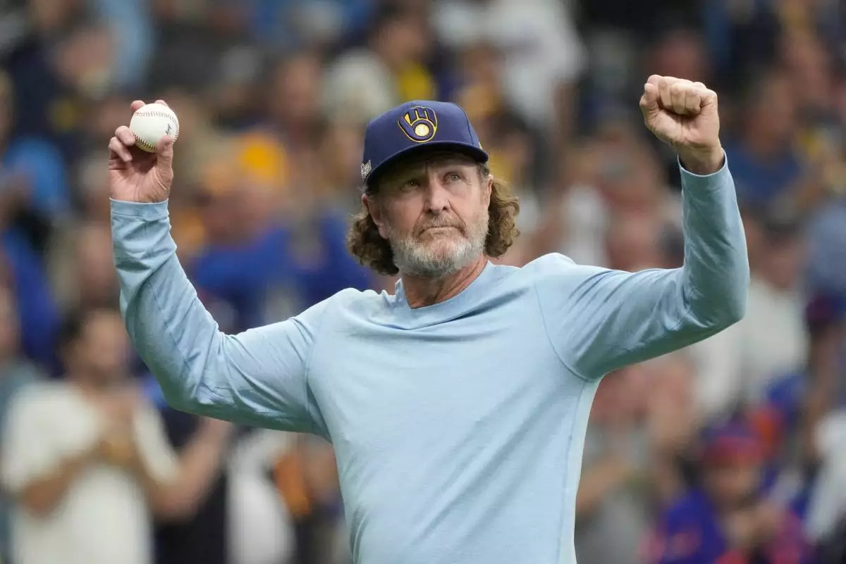 FILE - Former Milwaukee Brewers Robin Yount throws the ceremonial first pitch before Game 3 of a National League wild card baseball game against the New York Mets on Oct. 3, 2024, in Milwaukee. (AP Photo/Morry Gash, File)