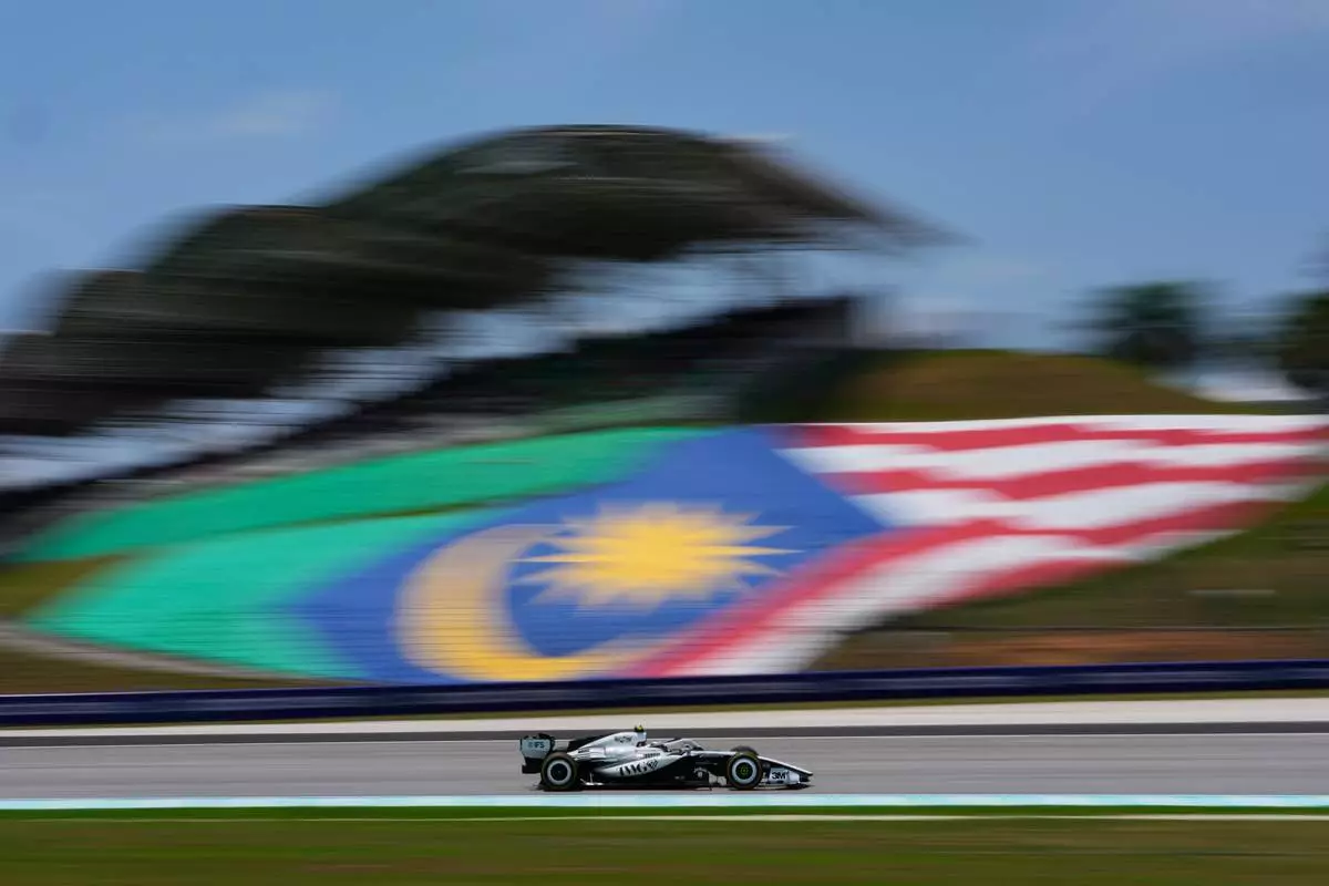 Cadillac driver Valtteri Bottas of Finland steers his car during the first free practice session ahead of the Bahrain Grand Prix in Sepang, Malaysia, Friday, Oct. 2, 2026. (AP Photo/Vincent Thian)