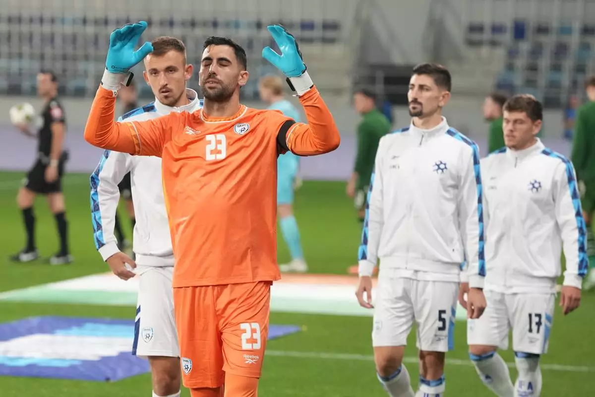 Israel's goalkeeper Assaf Tzur oerforms a ritual before the UEFA Nations League soccer match between the Republic of Ireland and Israel in Backa Topola, Serbia, Sunday, Oct. 4, 2026. (AP Photo/Darko Vojinovic)