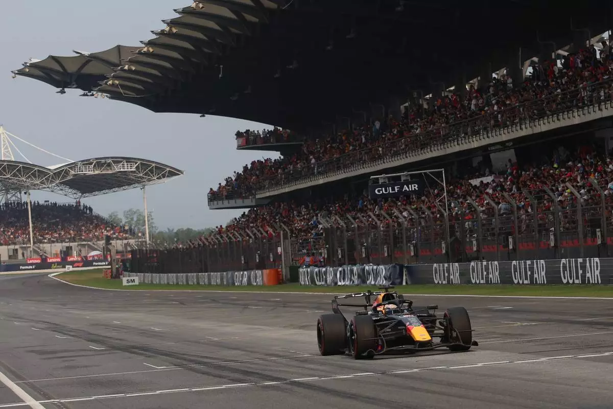 Red Bull driver Max Verstappen of the Netherlands steers his car during the Bahrain Grand Prix in Sepang, Malaysia, Sunday, Oct. 4, 2026. (Annice Lyn/Pool via AP )