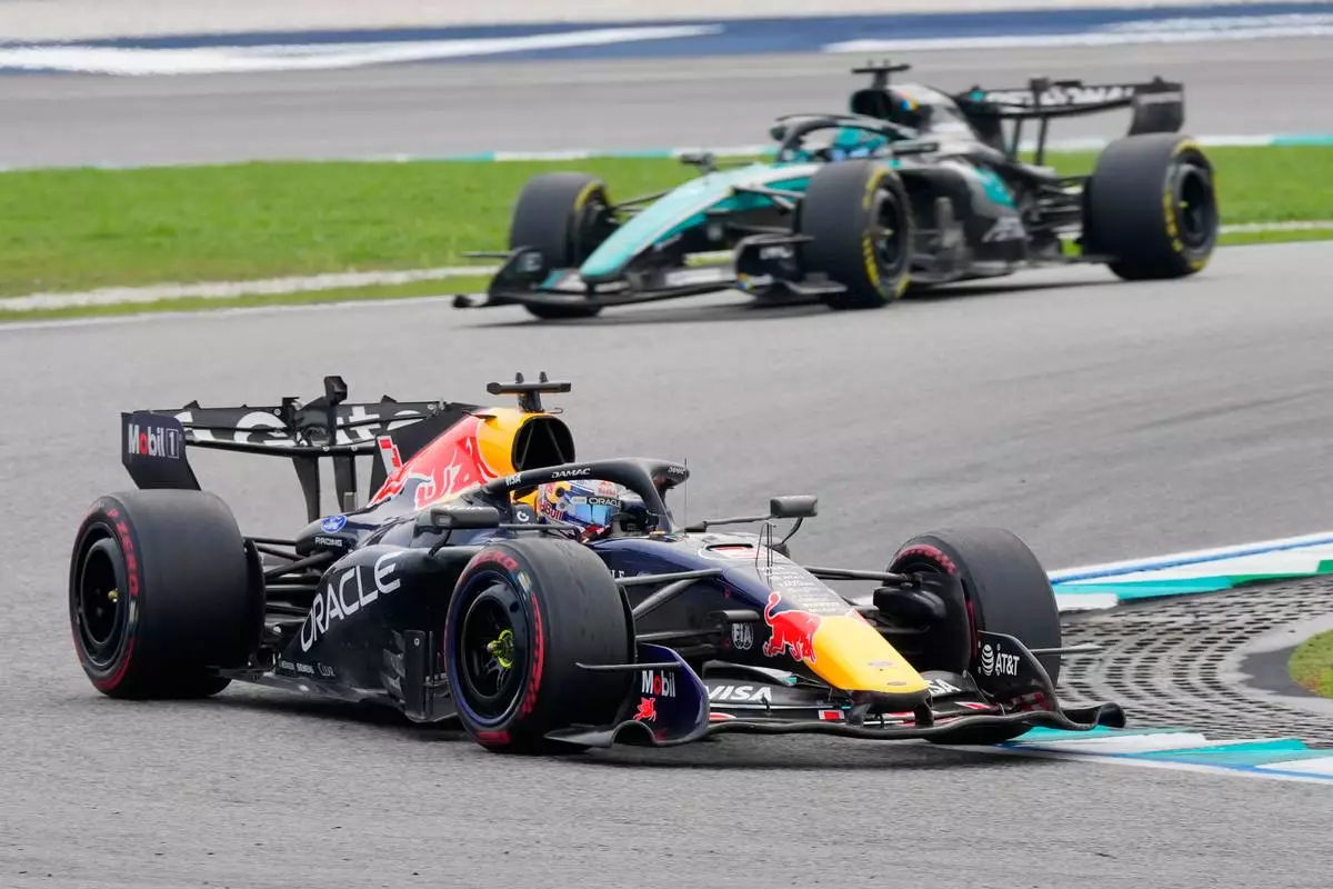 Red Bull driver Max Verstappen of the Netherlands steers his car ahead of Mercedes drivers George Russell of Britain during the Bahrain Grand Prix in Sepang, Malaysia, Sunday, Oct. 4, 2026. (AP Photo/Vincent Thian)