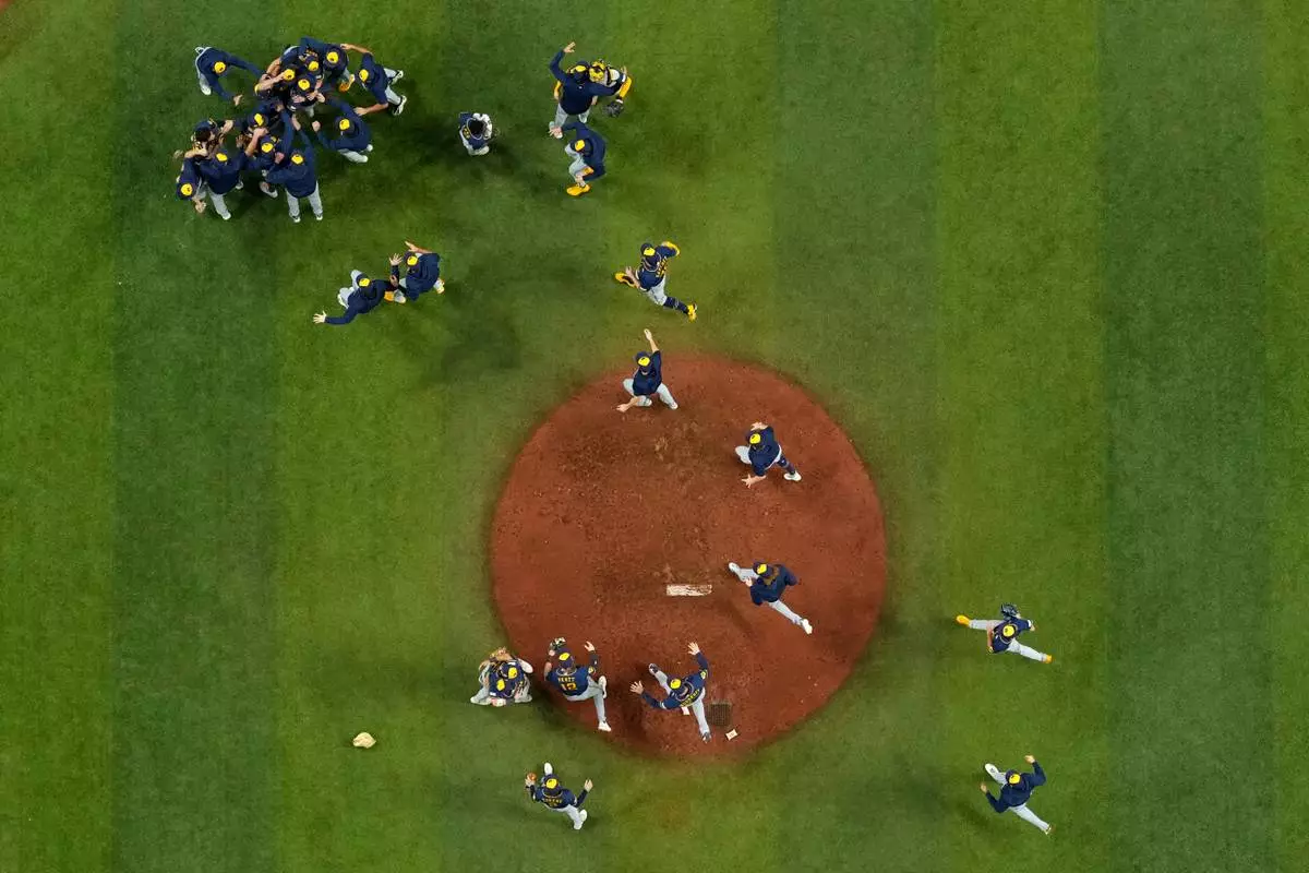 The Milwaukee Brewers celebrate after winning baseball's World Series against the Tampa Bay Rays, Wednesday, Oct. 28, 2026, in St. Petersburg, Fla. (AP Photo/Ashley Landis)