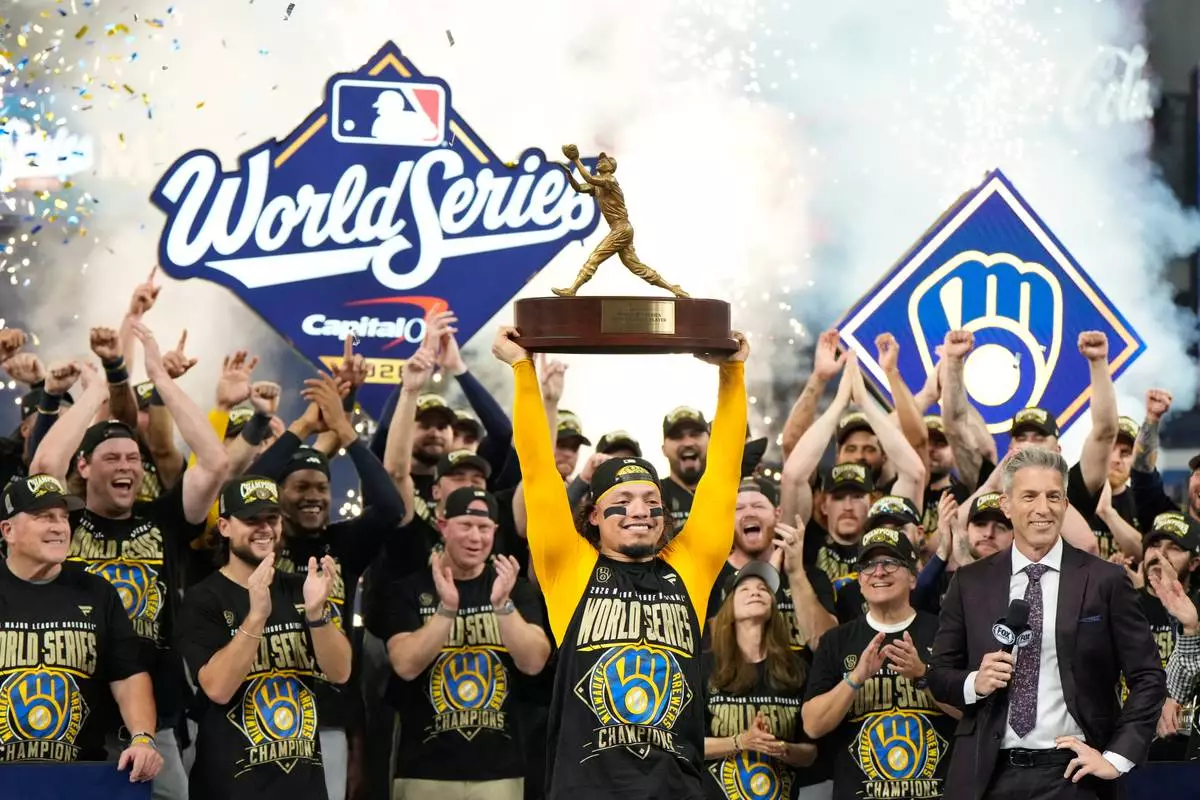 Milwaukee Brewers catcher William Contreras holds the MVP trophy after they won baseball's World Series against the Tampa Bay Rays, Wednesday, Oct. 28, 2026, in St. Petersburg, Fla. (AP Photo/Ashley Landis)