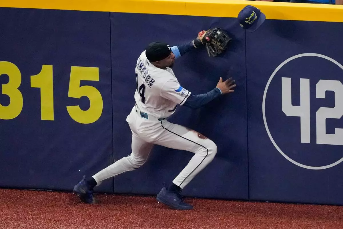 Tampa Bay Rays left fielder Chandler Simpson catches a long fly out hit by Milwaukee Brewers right fielder Sal Frelick during the second inning of Game 3 of baseball's World Series, Monday, Oct. 26, 2026, in St. Petersburg, Fla., between the Milwaukee Brewers and the Tampa Bay Rays. (AP Photo/Morry Gash)