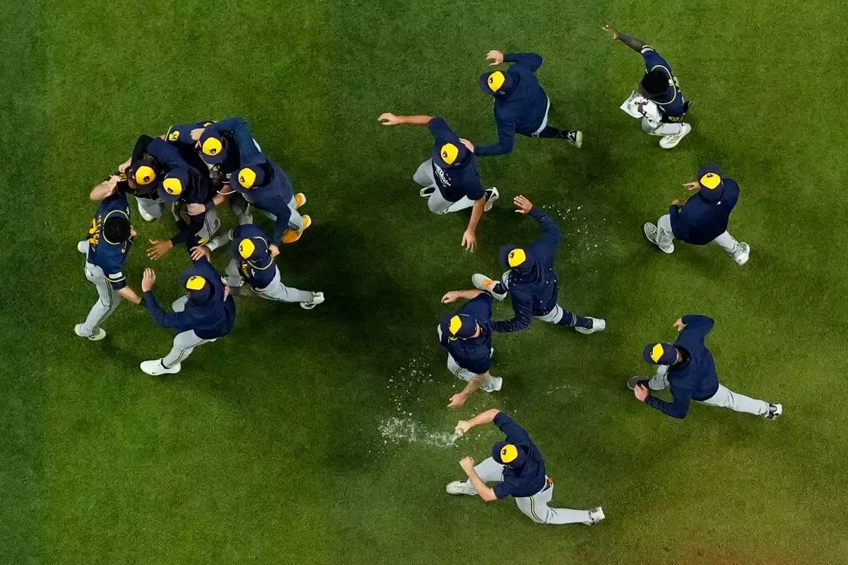 The Milwaukee Brewers celebrate after winning baseball's World Series against the Tampa Bay Rays, Wednesday, Oct. 28, 2026, in St. Petersburg, Fla. (AP Photo/Ashley Landis)