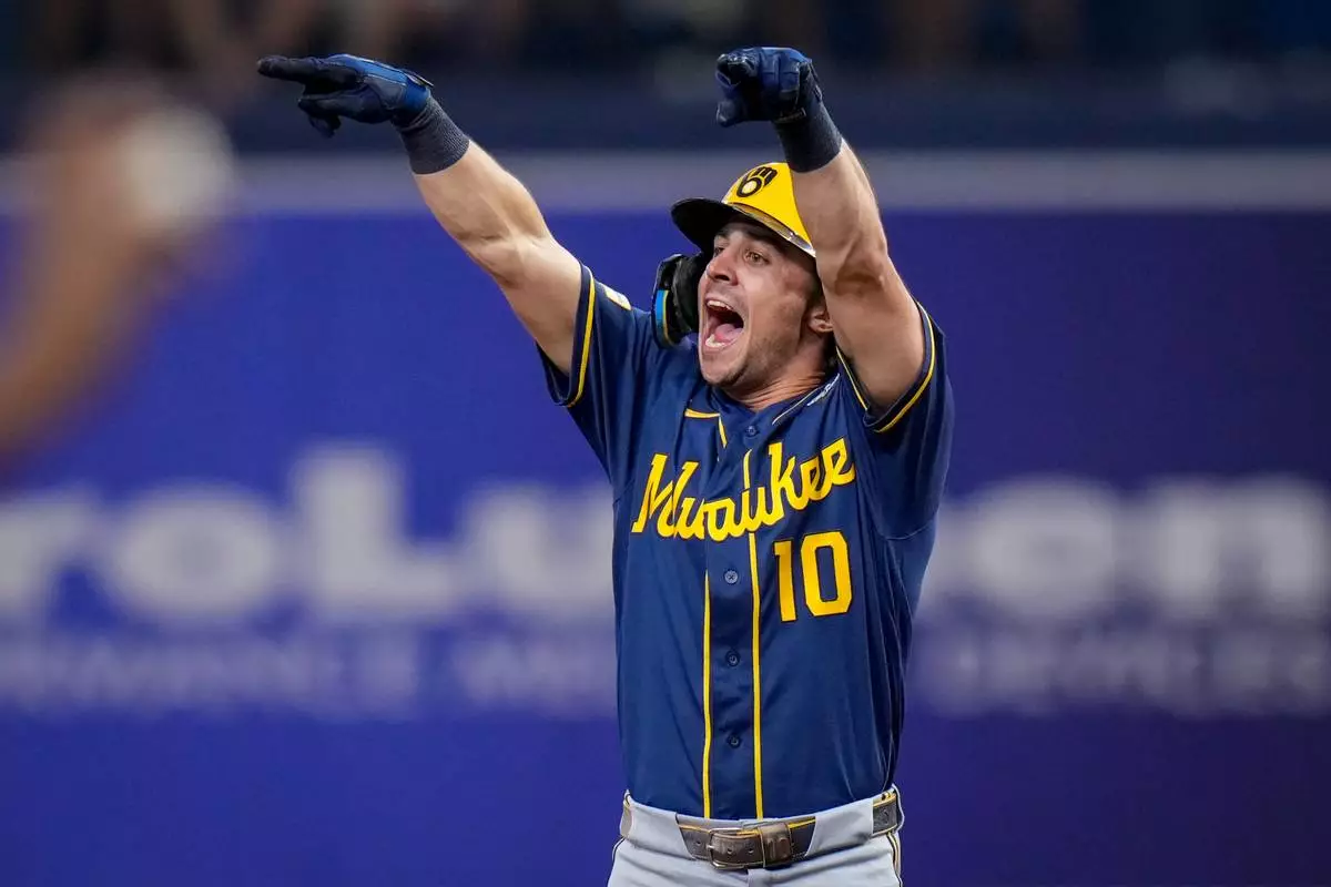 Milwaukee Brewers right fielder Sal Frelick celebrates his RBI double during the fifth inning of Game 3 of baseball's World Series, Monday, Oct. 26, 2026, in St. Petersburg, Fla., between the Milwaukee Brewers and the Tampa Bay Rays. (AP Photo/Chris O'Meara)