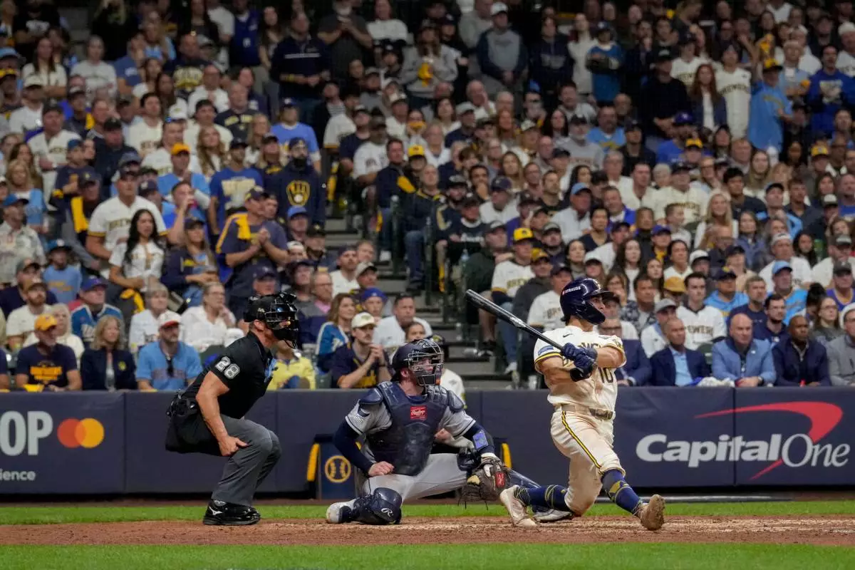 Milwaukee Brewers right fielder Sal Frelick follows through on a solo home run during the sixth inning of Game 2 of baseball's World Series, Saturday, Oct. 24, 2026, in Milwaukee, between the Milwaukee Brewers and the Tampa Bay Rays. (AP Photo/Ashley Landis)