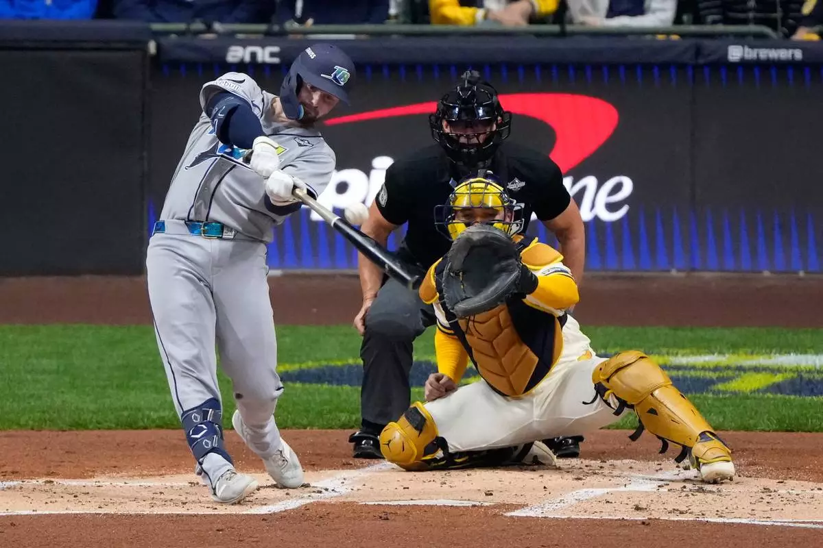 Tampa Bay Rays' Liam Hicks hits a two-run home run first inning of Game 2 of baseball's World Series, Saturday, Oct. 24, 2026, in Milwaukee, between the Milwaukee Brewers and the Tampa Bay Rays. (AP Photo/David J. Phillip)
