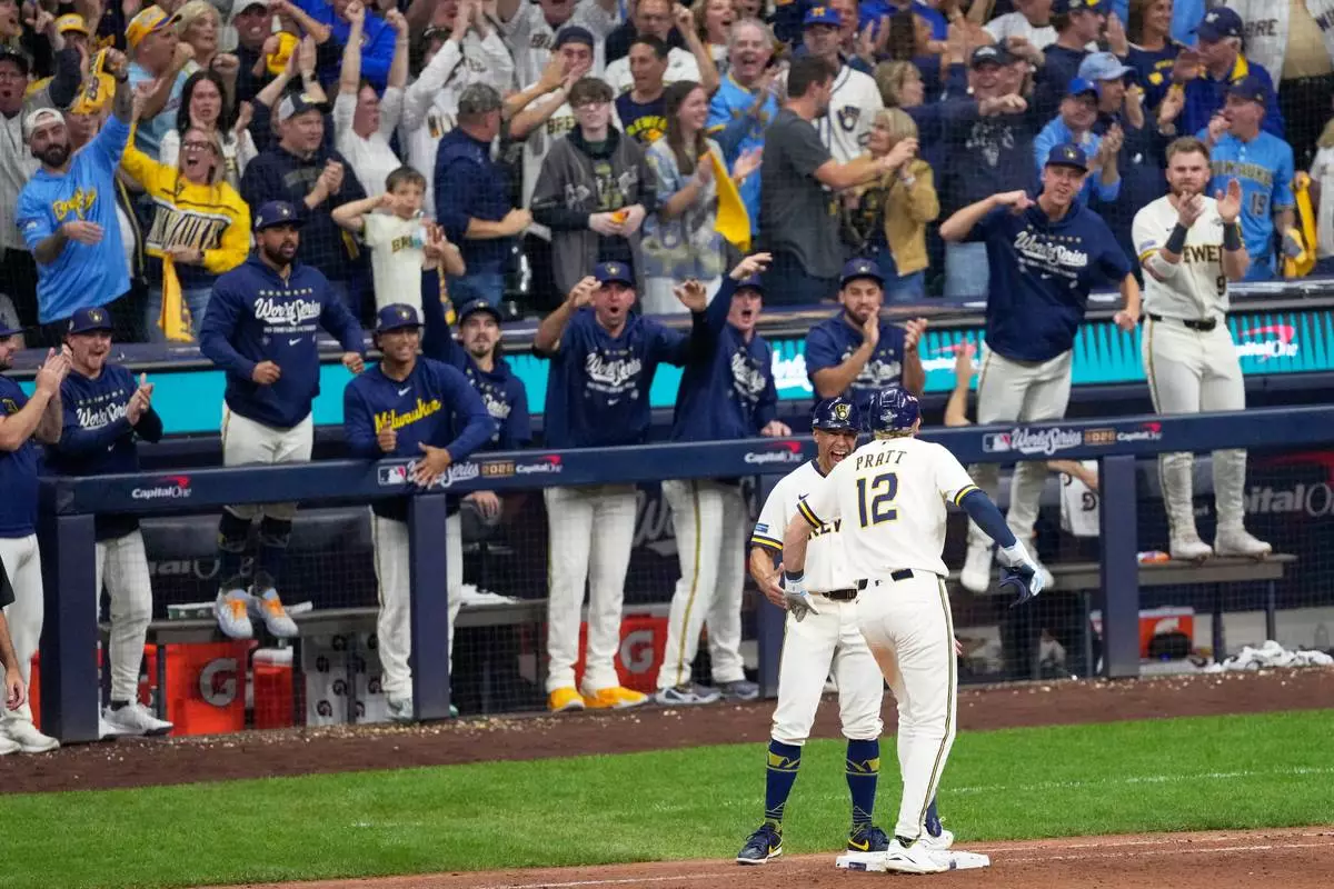 Milwaukee Brewers' Cooper Pratt celebrates a RBI-single during the seventh inning of Game 2 of baseball's World Series, Saturday, Oct. 24, 2026, in Milwaukee, between the Milwaukee Brewers and the Tampa Bay Rays. (AP Photo/David J. Phillip)