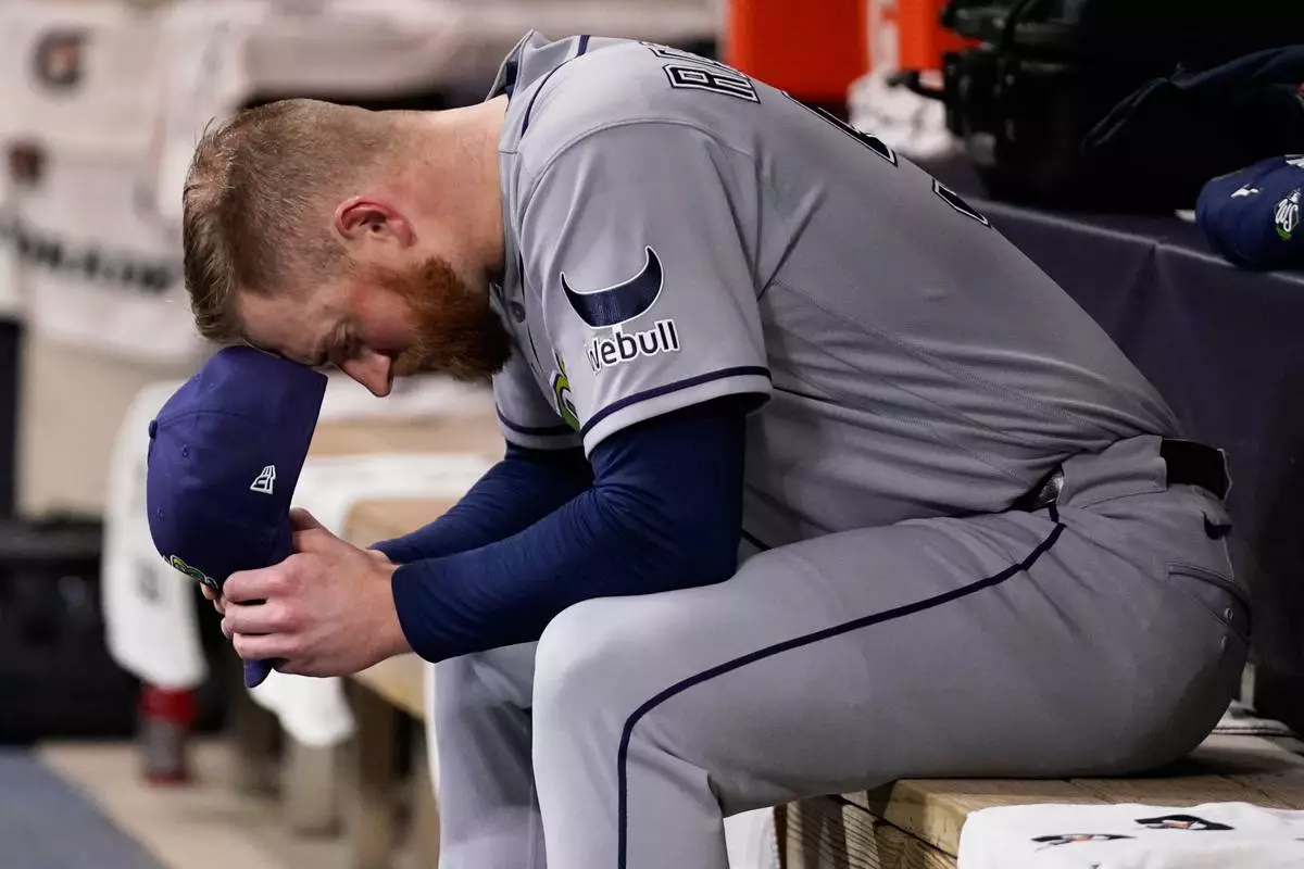 Tampa Bay Rays pitcher Drew Rasmussen waits in the dugout for the the start of Game 2 of baseball's World Series, Saturday, Oct. 24, 2026, in Milwaukee, between the Milwaukee Brewers and the Tampa Bay Rays. (AP Photo/Kayla Wolf)