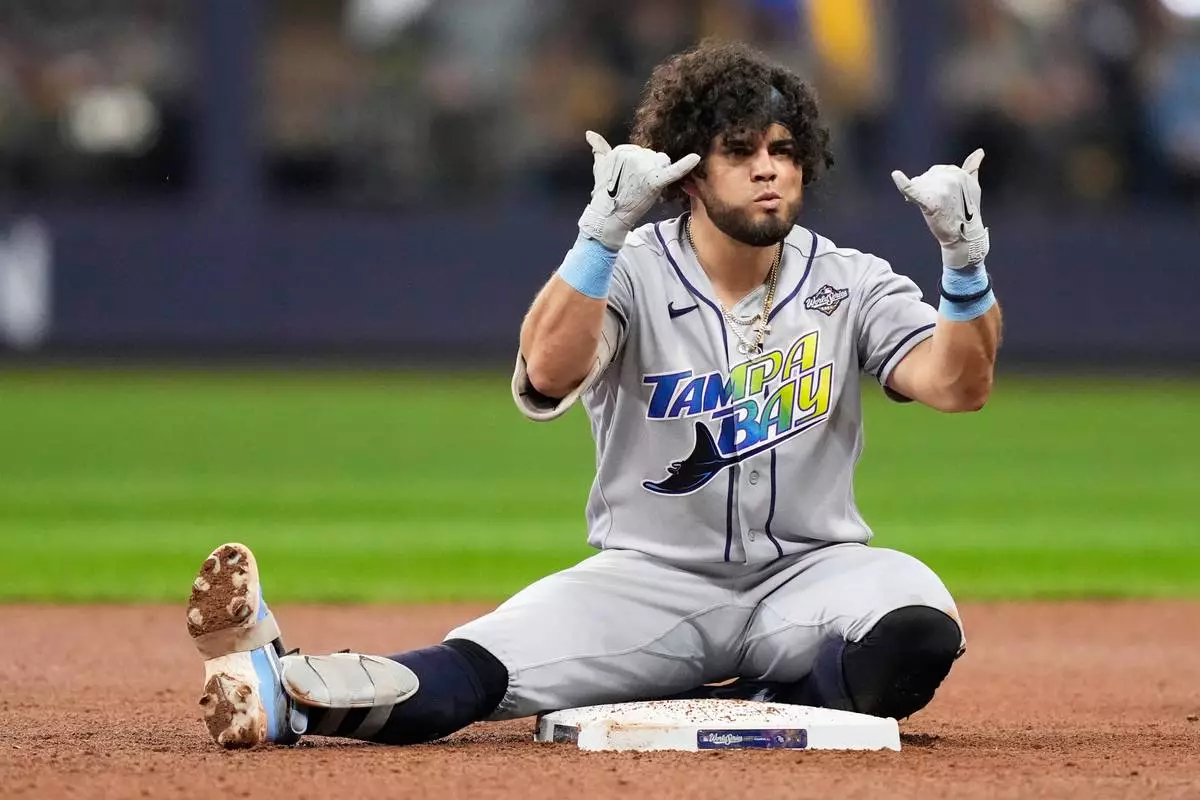 Tampa Bay Rays' Jonathan Aranda celebrates a double during the fifth inning of Game 2 of baseball's World Series, Saturday, Oct. 24, 2026, in Milwaukee, between the Milwaukee Brewers and the Tampa Bay Rays. (AP Photo/Kayla Wolf)