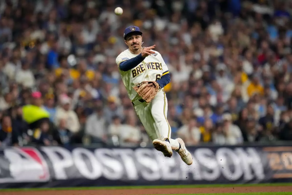 Milwaukee Brewers third baseman David Hamilton throws out Tampa Bay Rays designated hitter Yandy Diaz, during the fifth inning of Game 2 of baseball's World Series, Saturday, Oct. 24, 2026, in Milwaukee, between the Milwaukee Brewers and the Tampa Bay Rays. (AP Photo/Ashley Landis) CORRECTION: Corrects the player who was thrown out to Tampa Bay Rays designated hitter Yandy Diaz, instead of Milwaukee Brewers second baseman Brice Turang