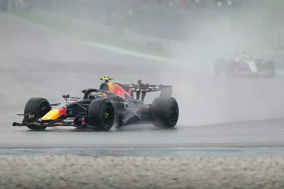 Red Bull driver Isack Hadjar of France steers his car during the formation lap prior to the start of the Bahrain Grand Prix in Sepang, Malaysia, Sunday, Oct. 4, 2026. (AP Photo/Aijaz Rahi)