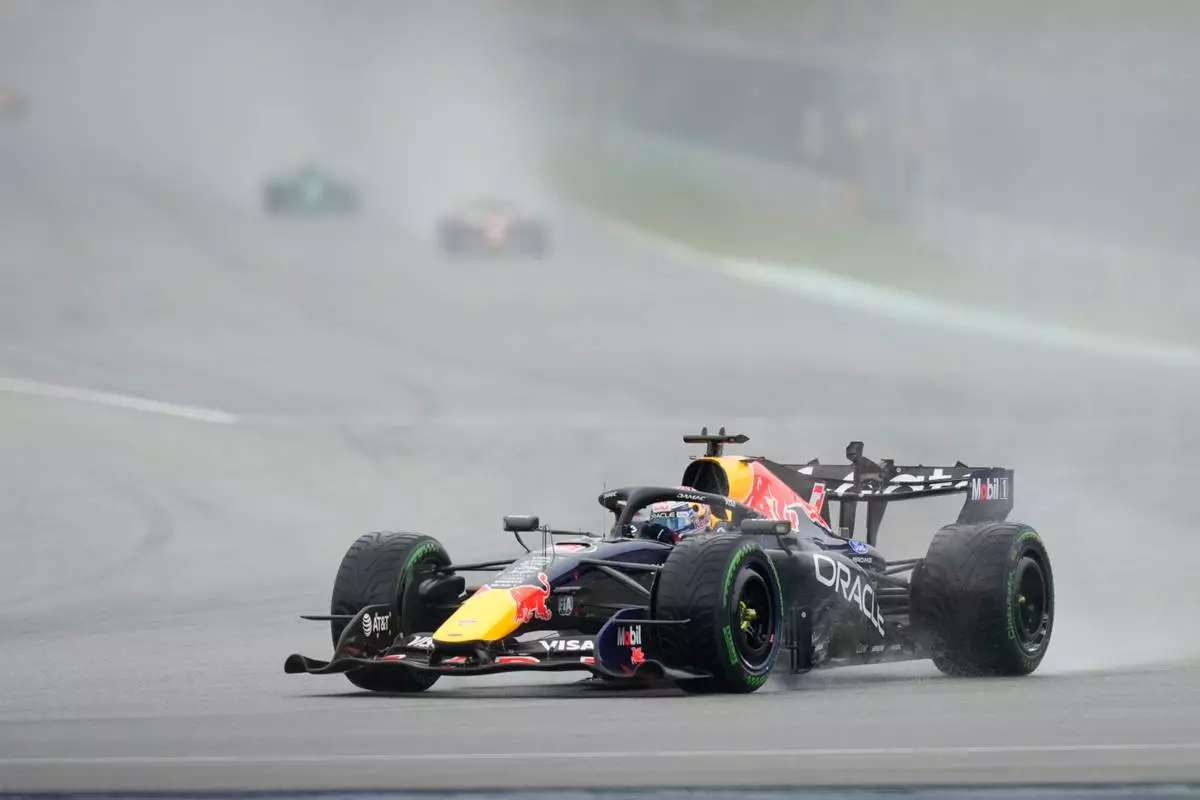 Red Bull driver Max Verstappen of the Netherlands steers his car during the formation lap prior to the delayed start of the Bahrain Grand Prix in Sepang, Malaysia, Sunday, Oct. 4, 2026. (AP Photo/Aijaz Rahi)