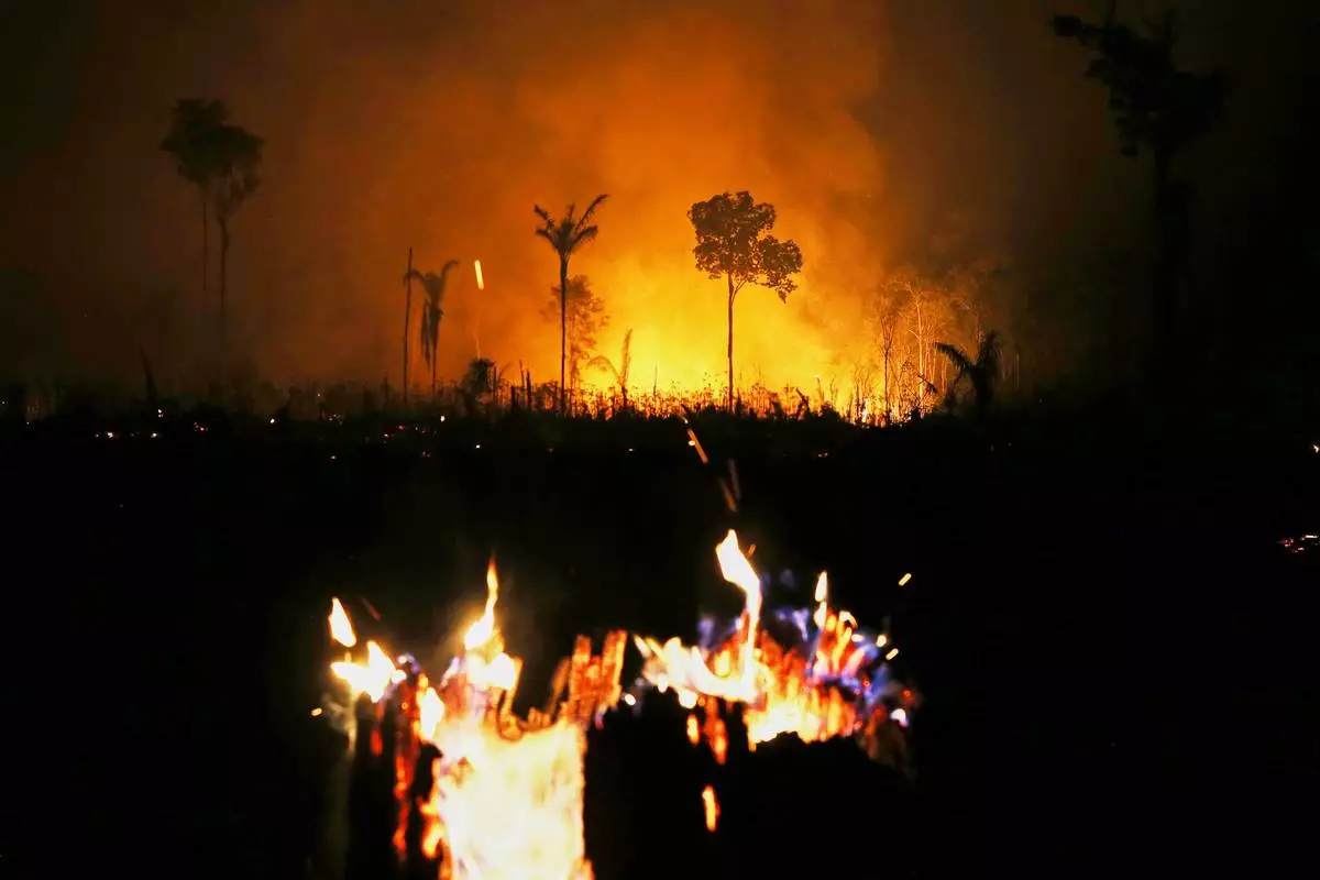 FILE - Wildfires burn in the municipality of Autazes, Amazonas state, Brazil, Oct. 12, 2026. (AP Photo/Edmar Barros, File)