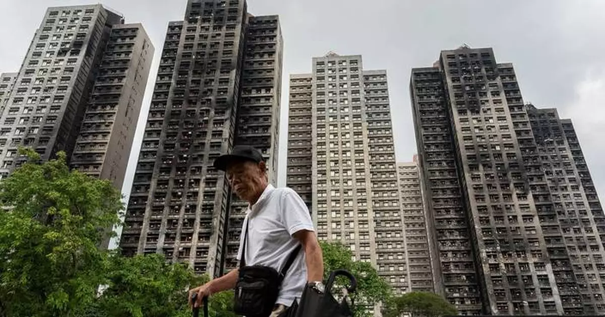 Hong Kong's housing minister resigns after fire investigation finds inadequate oversight
