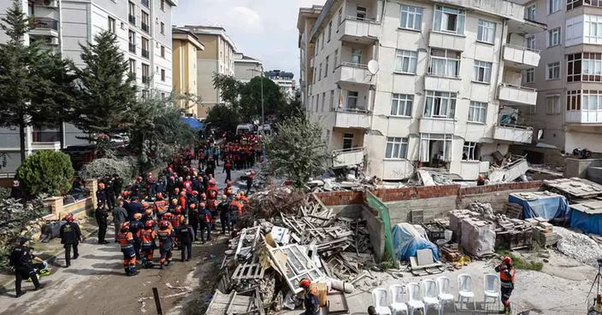 A partial building collapse in Istanbul kills 2 and traps at least 2 more